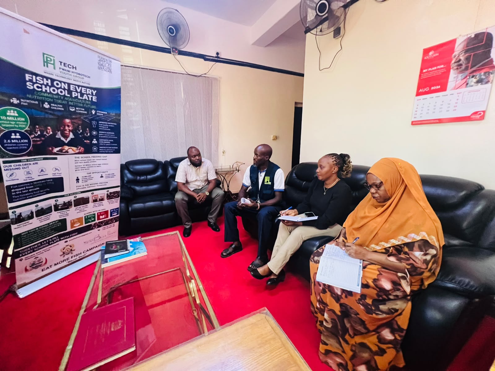 FESP briefing session at CDA headquarters with the Fish on Every School Plate banner