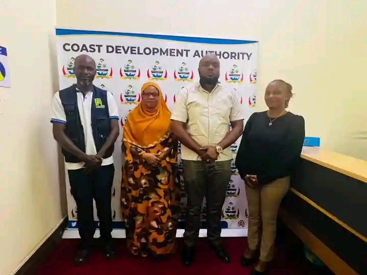 PHYG delegation with CDA leadership at the Coast Development Authority backdrop